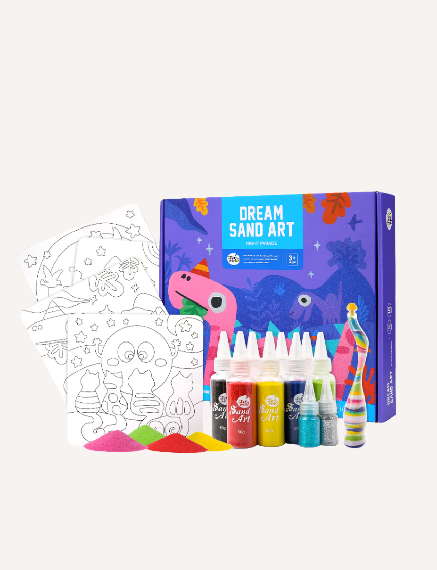 A colorful box titled "Sand Art - Night Parade" by Jar Melo, featuring a dinosaur-themed design. The box is predominantly purple and pink, displaying a friendly pink dinosaur and other prehistoric illustrations. It includes caution and warning labels for small parts and sharp points. Suitable for ages 3+.