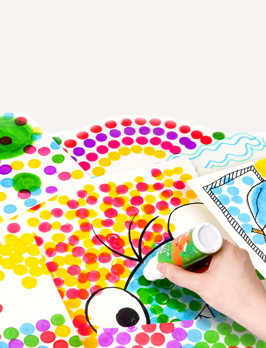 A large green box contains children's art supplies designed to foster creative expression: it features the Jar Melo Fine Motor Practice: Puzzle and Art Kit, which includes a pack of Giant Finger Paint Paper with a blue octopus and yellow crocodile, a Dot Painting Kit filled with colorful dots, and animal-themed tools that enhance fine motor skills.