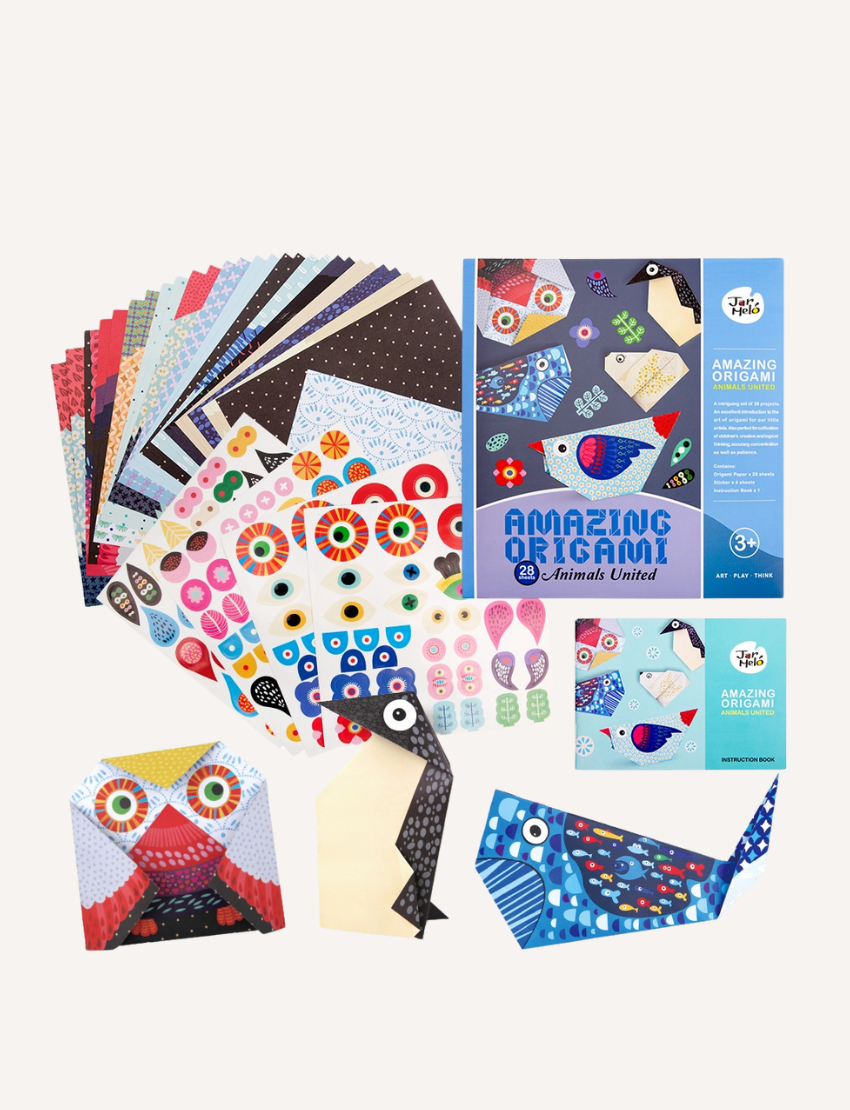 A blue and purple box features the "Amazing Origami - Animals United" kit by Jar Melo. The box showcases colorful animal origami examples and includes 28 pre-printed sheets, an instruction book, and is suitable for ages 3 and up. It also contains a choking hazard warning.