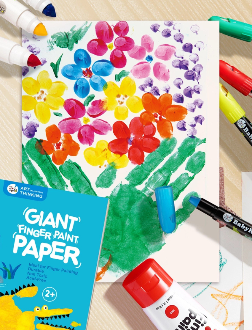 A large green box contains children's art supplies designed to foster creative expression: it features the Jar Melo Fine Motor Practice: Puzzle and Art Kit, which includes a pack of Giant Finger Paint Paper with a blue octopus and yellow crocodile, a Dot Painting Kit filled with colorful dots, and animal-themed tools that enhance fine motor skills.