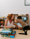 An open Therapy At Home Language Promotion Program box with playful green and teal designs reveals educational books, cards, and colorful language development activity materials neatly arranged inside.