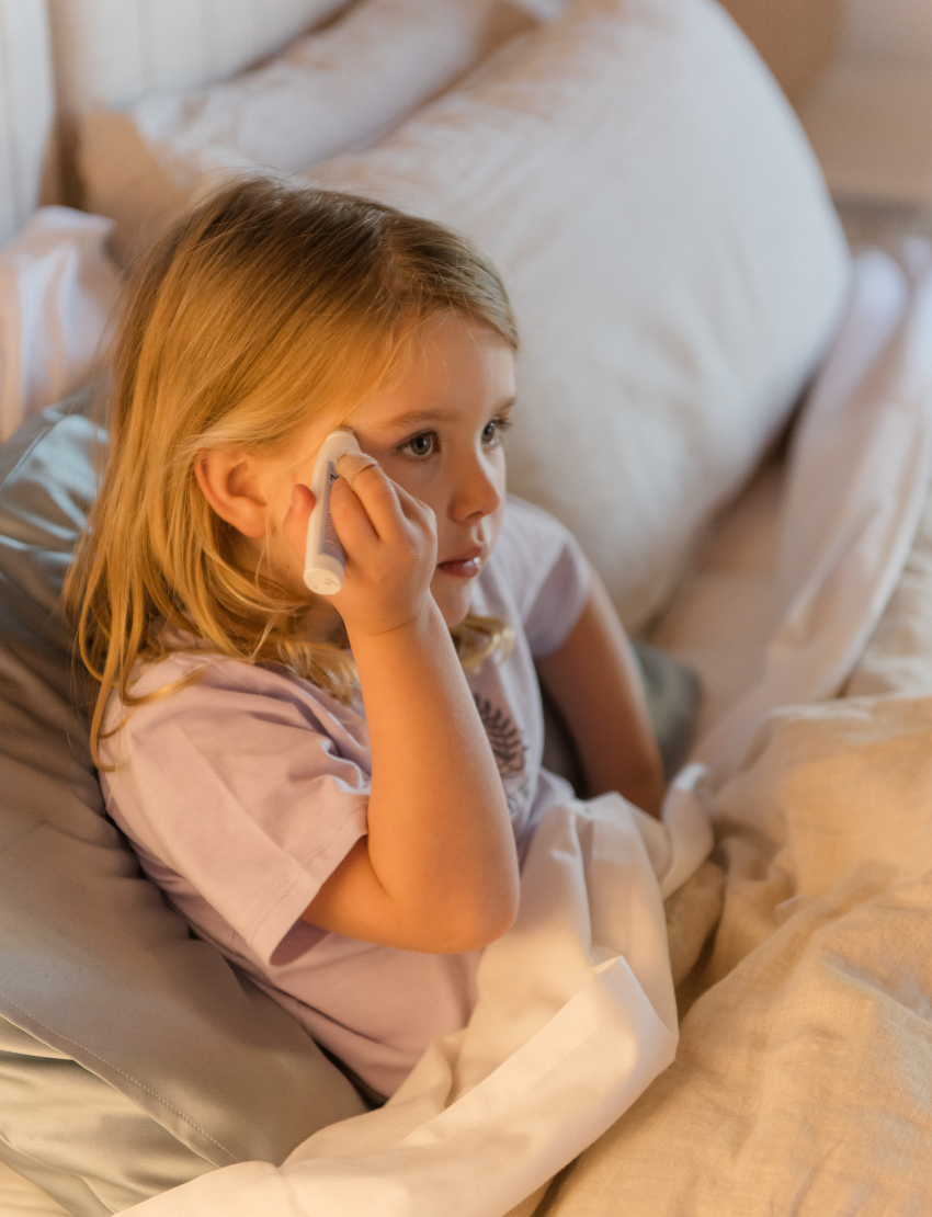 A round, light blue box labeled "Sensory Play Australia" contains the "Sleep Set," which includes a white cylindrical bottle labeled "Melo Dream," a brown spray bottle labeled "Melo," and a folded light blue fabric item, possibly an eye mask or pillowcase.