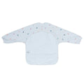 Messie Smock Bib featuring long sleeves and an all-over pattern of small multicolored shapes on a white background.