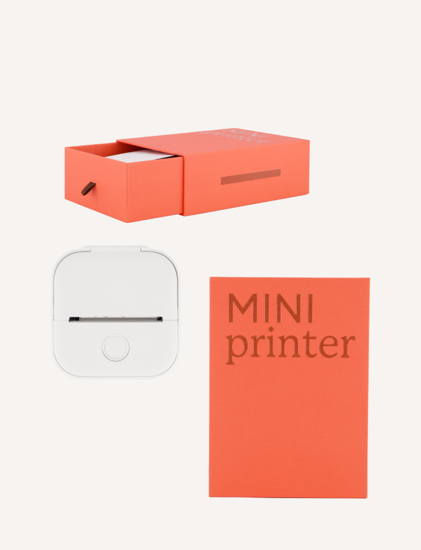 The Mini Printer set from Sensory Play Australia, showing its orange box, white printer, and orange booklet for creative fun.