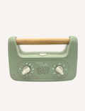 Sporting a soft green design and a wooden handle, the My Little Morphee Relaxation & Sleep Aid by Morphee features two dials and a speaker grille. The front showcases white illustrations along with the brand name 