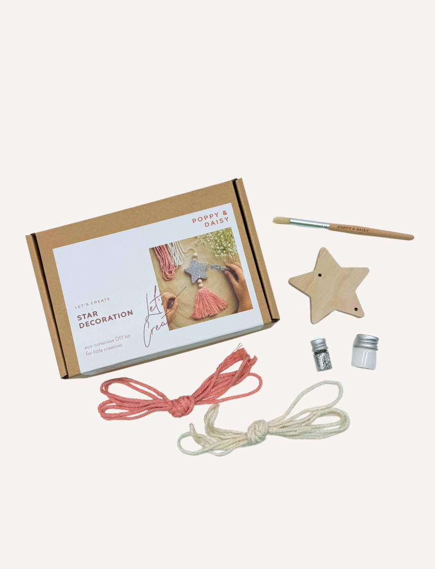 Poppy & Daisy 'Star Decoration' DIY kit: box, wooden star, glitter, brush, twine, and tassel.
