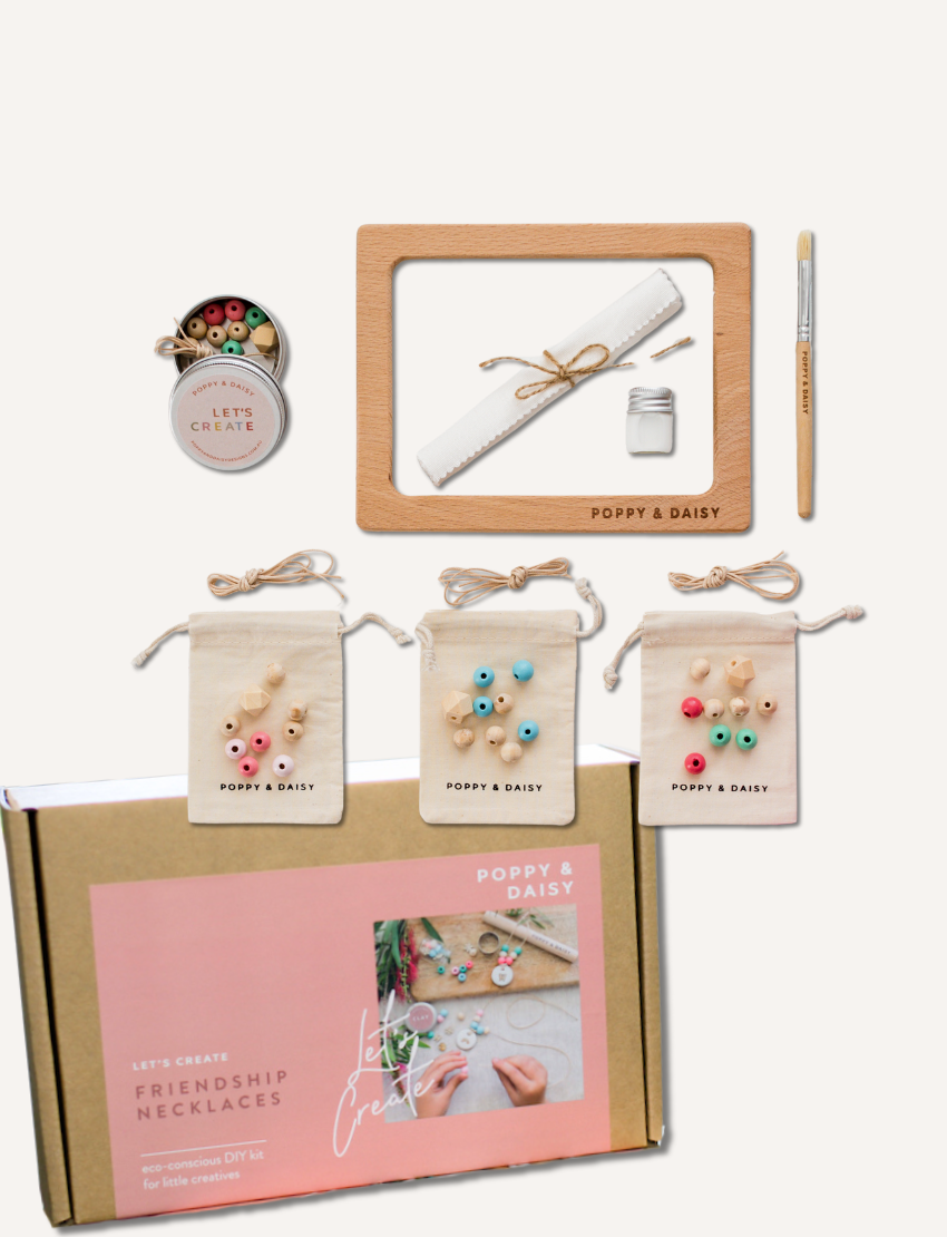 Poppy & Daisy 'Let's Create Friendship Necklaces' kit contents displayed, including box.