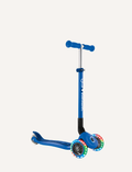 The PRIMO Foldable Lights Scooter by Globber is a blue children's scooter featuring three wheels, a T-shaped handlebar, and LED lights on the front wheels. It boasts a sleek design with a sturdy frame, casting a shadow on the ground.