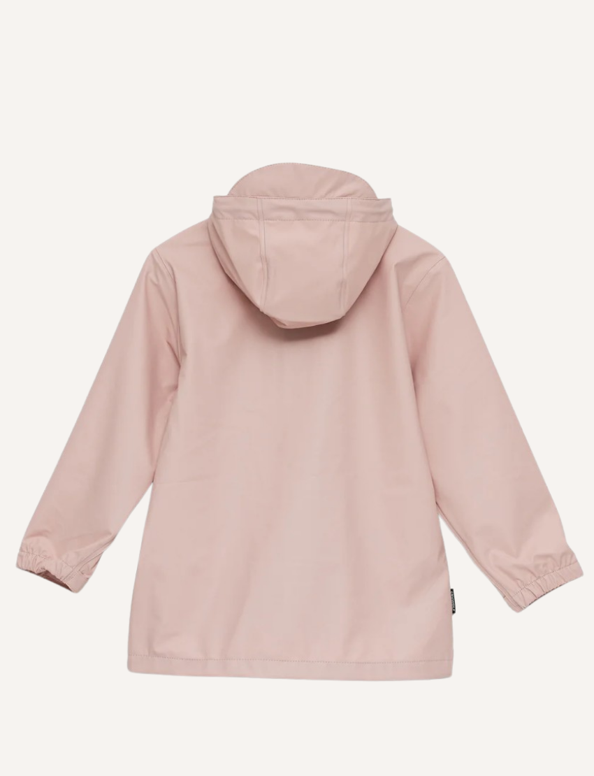 The Play Jacket - Dusty Pink by Cry Wolf is an eco-friendly raincoat featuring long sleeves, a buttoned front, two pockets, and a small embroidered logo on the upper left chest.