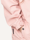 A Play Jacket - Dusty Pink by Cry Wolf is shown from the back, featuring long sleeves with elastic cuffs and a slightly elongated hem. The fabric appears smooth and lightweight.