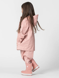 A Play Jacket - Dusty Pink by Cry Wolf is shown from the back, featuring long sleeves with elastic cuffs and a slightly elongated hem. The fabric appears smooth and lightweight.