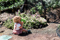 The EverEarth Outdoor Gardening Bag With Tools is a green set ideal for children's outdoor play, featuring a watering can, spade, trowel, and small fork with wooden handles. These tools are neatly displayed in front of a canvas tote decorated with green polka dots and multiple pockets.