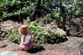 The EverEarth Outdoor Gardening Bag With Tools is a green set ideal for children's outdoor play, featuring a watering can, spade, trowel, and small fork with wooden handles. These tools are neatly displayed in front of a canvas tote decorated with green polka dots and multiple pockets.
