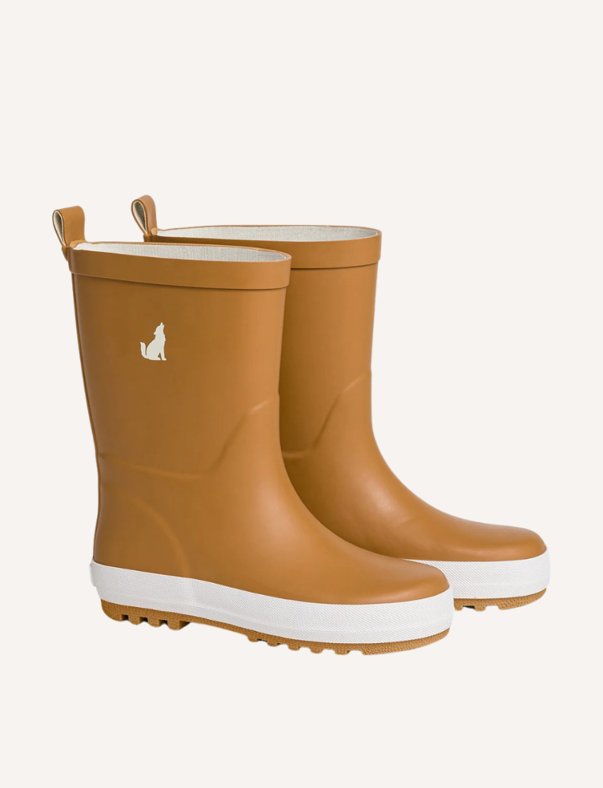 Pair of tan children's rain boots with white soles and wolf logo, presented on a light background.