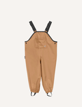 A pair of children's tan waterproof Rain Overalls from Cry Wolf with elasticated ankle cuffs, black adjustable shoulder straps, and the words 