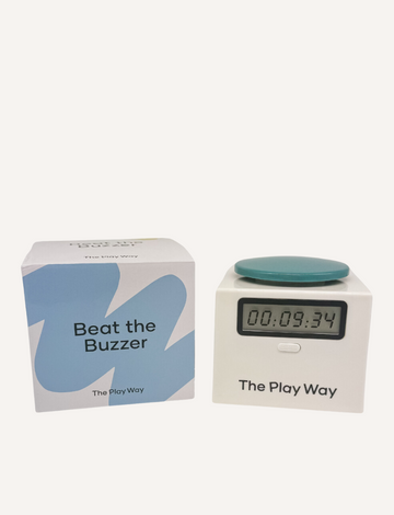 The game set "Beat the Buzzer" by The Play Way features a ninja timer with "00:09.34" on its display and a green button on top. Both the timer and box are branded with The Play Way name.