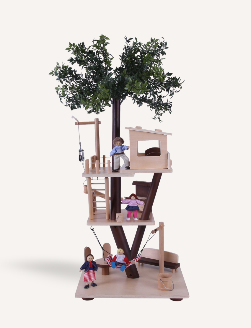 The Ever Earth Tree House is a wooden toy with three levels, featuring miniature furniture, figures, and accessories. It includes a swing on one side and a rope ladder on the opposite side. At the top, there is a small artificial tree surrounded by figures posed in various activities.