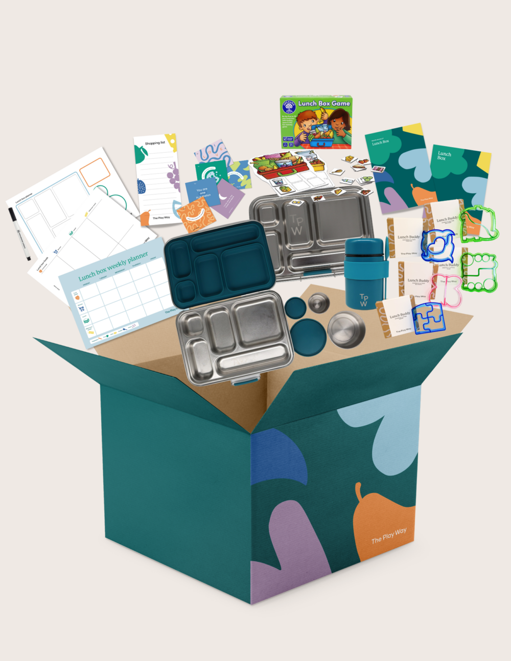 The Lunch Box Program by Therapy At Home comes in a teal and blue patterned box with stainless steel containers, a blue cup, activity cards, planners, a game, and labels—all neatly packed and partially displayed.