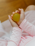 The Regulation: Discovering your Calm Program by Therapy At Home features a teal box with colorful shapes, a blue bag, children’s book, regulation cards, yellow ball, toy phone, pacifiers, bottle nipples, and gray pacifier holder on a light background.