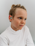 The Regulation: Discovering your Calm Program by Therapy At Home features a teal box with colorful shapes, a blue bag, children’s book, regulation cards, yellow ball, toy phone, pacifiers, bottle nipples, and gray pacifier holder on a light background.