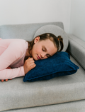 The Regulation: Discovering your Calm Program by Therapy At Home features a teal box with colorful shapes, a blue bag, children’s book, regulation cards, yellow ball, toy phone, pacifiers, bottle nipples, and gray pacifier holder on a light background.