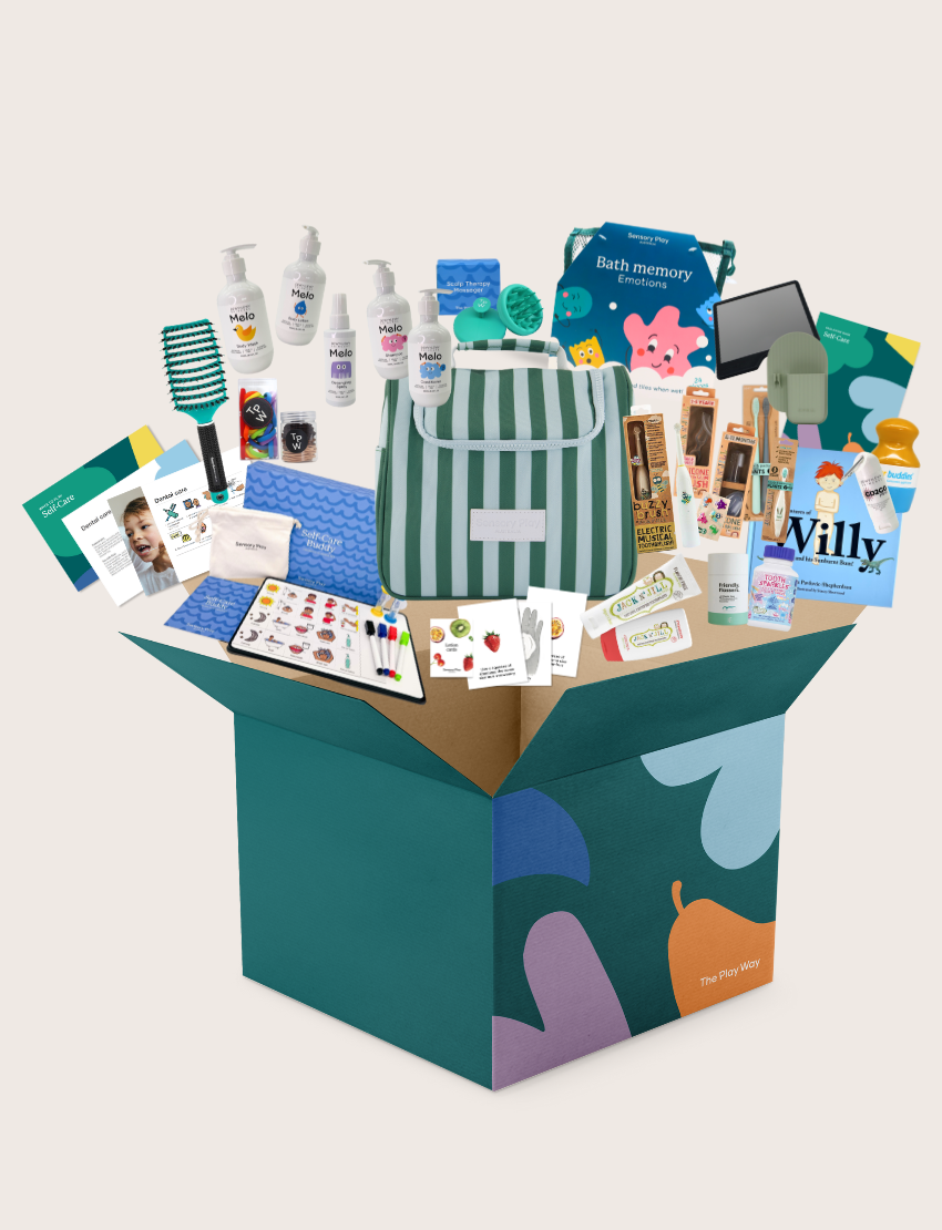 The Therapy At Home Self-Care Program features an open teal gift box filled with lotions, a striped bag, skincare essentials, cards, a hairbrush, and more—perfectly arranged for your self-care routine.
