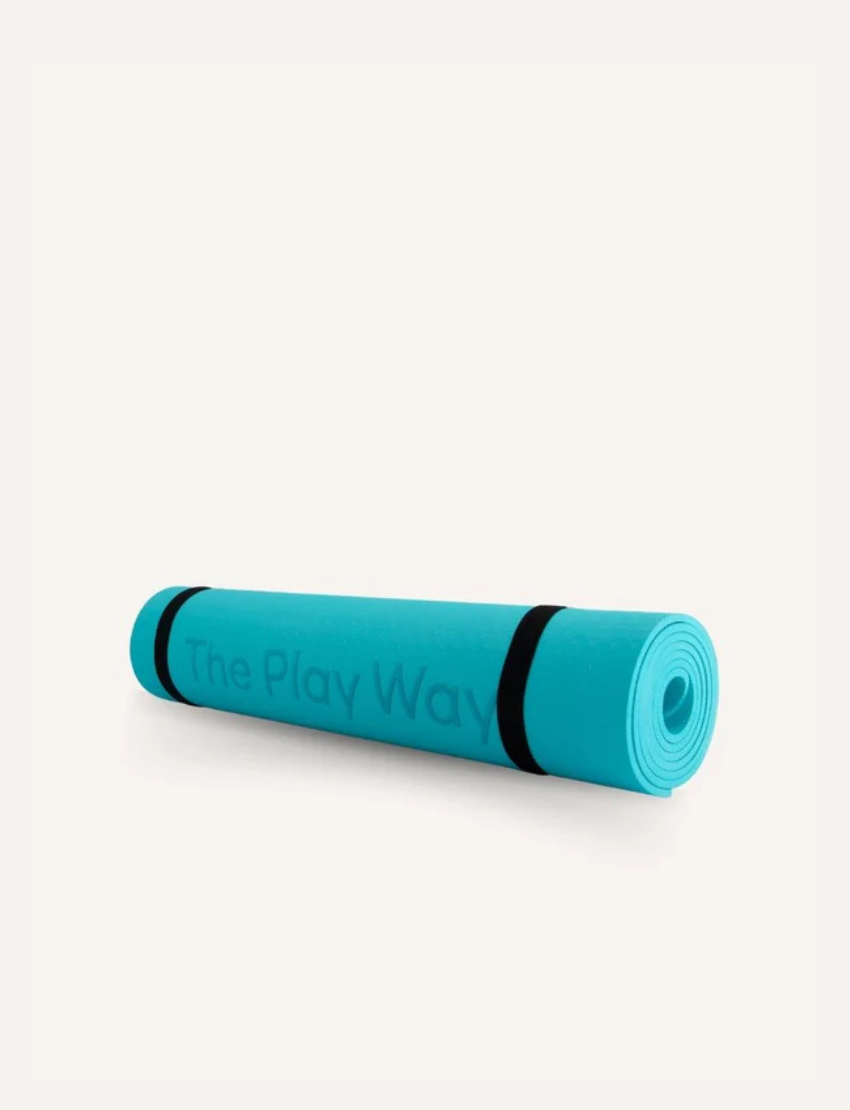 The Play Way small teal yoga mat, rolled with straps, providing a non-slip, cushioned surface for children and adults.