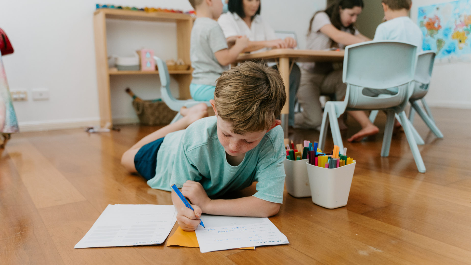 Children engaged in learning activities in a classroom, digital downloads available.