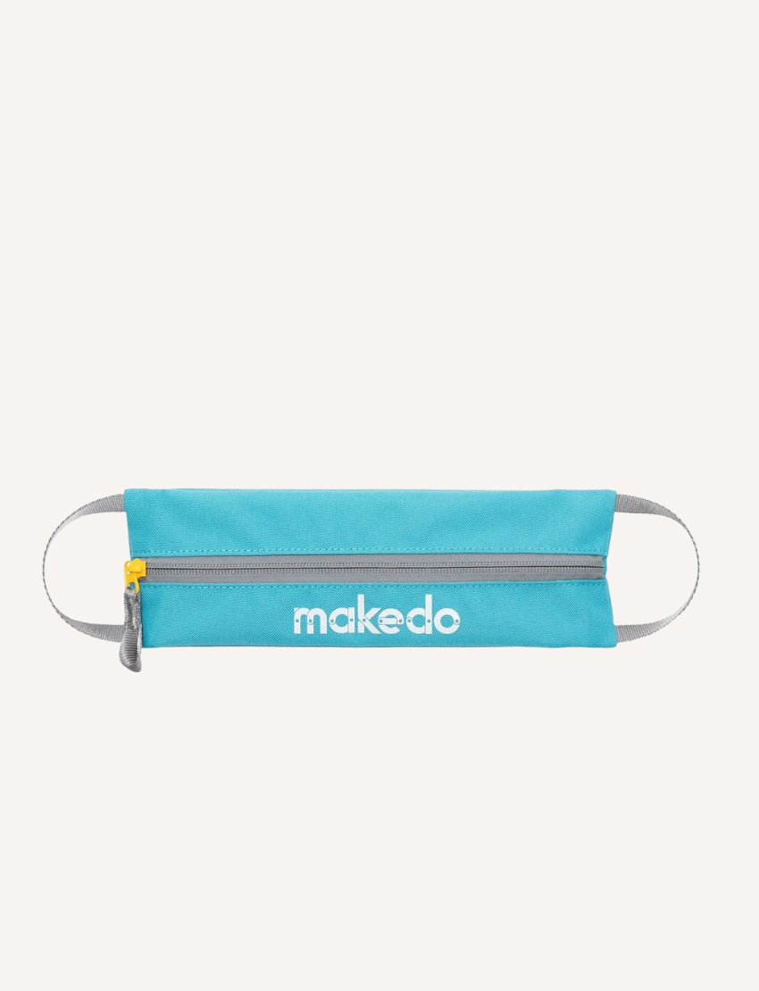 Makedo blue tool case with yellow zipper, on a plain light grey background.