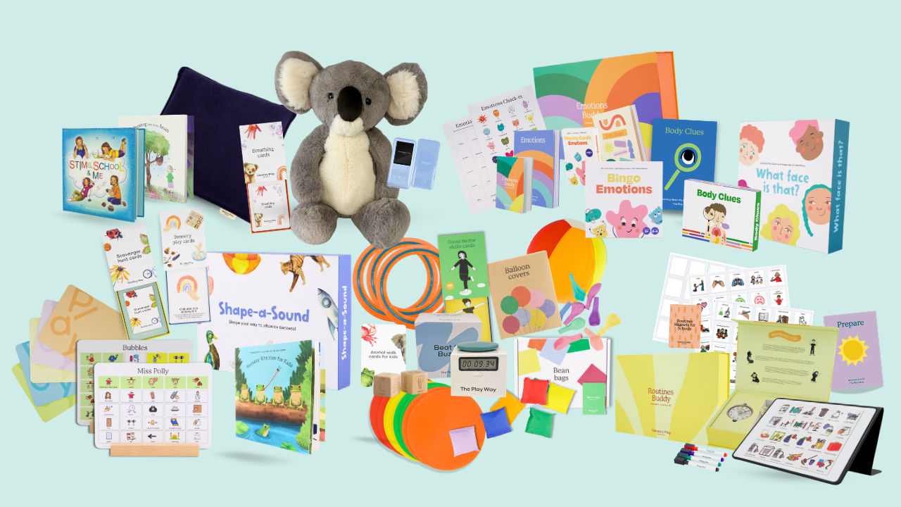 Educational materials including books, a plush koala, and colorful shapes on a light blue background